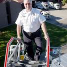 UC Davis Fire Chief Mike Chandler gets a bird&rsquo;s-eye view of the campus and fire station atop apparatus on the fire department&rsquo;s  105-foot ladder truck, which was put into service last year. A UC Davis alumnus &mdash; the chief is a former agricu