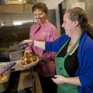 Photo: Sharon Coulson, Coffee House director, and Lauren Woods, CoHo South Cafe, manager, making a Quad Stack.