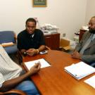 LeVale Simpson,  middle, talks about student-community relations issues with ASUCD Sen-ator Caliph Assagai, left, and Rahim Reed, of the Office of Campus-Community Relations. 
