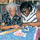 Photo: older and younger woman quilt together (from "Crafted Lives" book cover