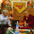 Psychologist Phil Shaver, left, talks with the Dalai Lama during a 2005 meeting of the Mind and Life Institute in the foothills of the Indian Himalayas. 