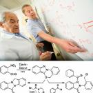 Photo and graphic: Professors Makhluf Haddadin and Mark Kurth at whiteboard, working on a formula