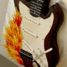 Photo: "Flaming" guitar cake (cropped)