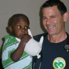 Doug Gross, right, and one of his Haitian patients.