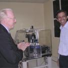 Chancellor Vanderhoef enjoys an exchange with an Indian Institute of Science researcher in Bangalore, India, who toured the UC Davis delegation through the institute's nanotechnology facility, outfitted with the latest in scientific equipment.