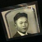 Photo: of a vintage badge with Henry Satoru Marubashi's photo