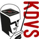 Graphic: KDVS logo (cropped), man holding a baton, and he has a turntable on top of his head