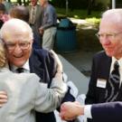 photo of John Kemper getting a hug  from Provost Virginia Hinshaw