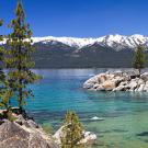 View of Lake Tahoe with snowy mountains in background
