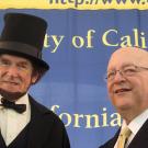 Man dressed as President Lincoln with UC President Mark Yudof