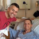 Photo: Mike Sheehan visits Brad Vernet at his hospital bed.