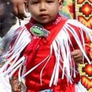 Photo: Toddler dressed in a traditional Native American costume