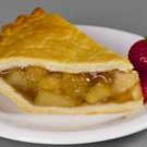 Photo: slice of apple pie with two strawberries