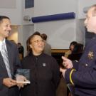 Medical Center telecommunications superintendent and twice-recognized award recipient, Michael Person, and his wife, Denise, chat with Police Lt. Matthew Carmichael during last week&rsquo;s ceremony.