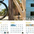 Photo image from calendar: "ONE" depicted by bicycle wheel ("O"), tree trunks and branch ("N"), and angles and shadows of the Social Sciences and Huma
