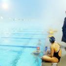 Barbara Jahn, head coach of UC Davis women&rsquo;s swimming, conducts practice during a foggy January morning at the aquatic center &mdash; the new home of all six of the campus&rsquo;s intercollegiate aquatic sports teams. 