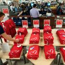 Photo: UC Davis Stores employee Oliver Mikkelson, a viticulture major, straightens display of heart T-shirts in the main bookstore.