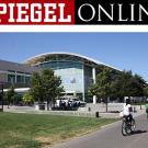 Logo and photo: Spiegel Online logo and two people on bikes near the ARC