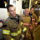 photo of campus student resident firefighter Kevin Taylor and two career firefighters
