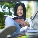 Photo: woman reading book