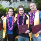 Photo: Julian and Sebastian Fletcher-Taylor and their dad, J. Edward Taylor, posing with diplomas in hand.