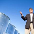 Photo: Professor Roger Boulton stands in front of rainwater collection tanks at the campus's winery-brewery complex.