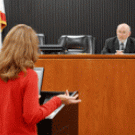 Photo of a law program student arguing a case before a judge in a mock courtroom at UC Davis