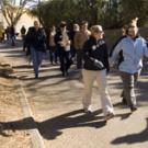 Nearly two dozen people set out on a group walk with Provost Virginia
Hingham, center in the second row, as part of the Winter Walkabout sponsored by Aggie On the Move on Jan. 17. The walk began in the ARC, where the provost gave a short pep ta