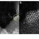 At left, panel shows a patch of regular white dots against a black background. Panel on right shows a zoomed in view of dots with a blurry blob at one corner. 